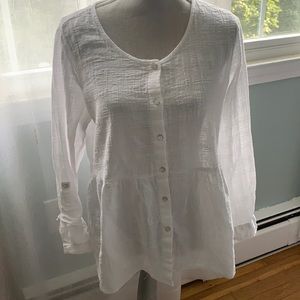 Fresh white blouse sleeves roll up to 3 quarters